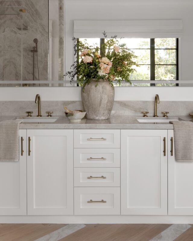 Four Point is celebrating >> 15 YEARS << this month, Lovelies, and we’re taking a fun look back at some of the highlights on our road so far! #15yearsandcounting #itsonlythebeginning 

Here’s a recent favorite primary bath from a very special (and much larger) project we love SO much! #4ptclientfrenchcontemporarywithakillerview 

Designing and building this home has been a lengthy and exciting 3 year process — and a treasured journey with the most wonderful clients. 

One of my favorite details in this beautiful primary bath (and there are SO many in this project) has to be the stunning custom wood and stone floors set in a herringbone pattern that flows seamlessly from the bedroom into the bath where the custom cut and polished natural stone planks gently and strategically integrate.  It took patience, time, and a VERY collaborative team spirit to accomplish this. It’s even more beautiful in person! 

Stay tuned as we wrap up the exteriors and shoot the rest of this entire project! The details and space planning magic is pretty astonishing. 🩶 #beforeandafter 

#4ptdbmoments ##15years #theroadsofar #cleanfreshmodern #interiorsforrealliving #losangeles #calabasas #westlakevillage #thousandoaks #studiocity 

Interior Architecture, Design and Build @4ptdesignbuild 
Photography @public311design